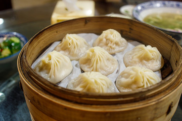A Tray of Chinese Dumplings with Soup Inside