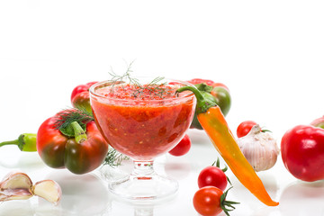 homemade hot adjika from tomatoes, hot and sweet peppers with spices