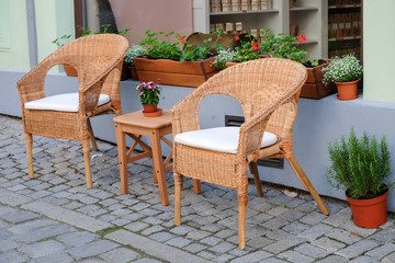 wooden chair in front of cafe