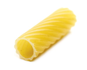 Uncooked short tubes shape pasta also known as tortiglioni or elicoidali isolated on white background