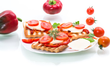 Closeup of a fresh sandwich with mozzarella, tomatoes