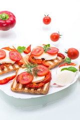Closeup of a fresh sandwich with mozzarella, tomatoes