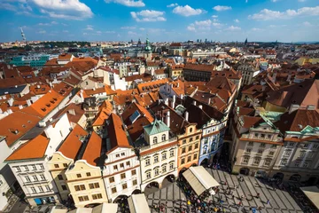 Deurstickers Houses with traditional red roofs in Prague Old Town Square in the Czech Republic © byjeng