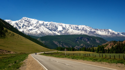 mountain panorama of Chui mountain range in Altai with snow, Russia, June