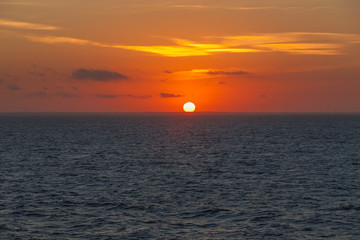Awesome sunset on the Adriatic coast that colors the sky with orange