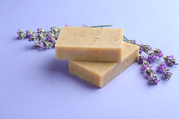Hand made soap bars with lavender flowers on violet background