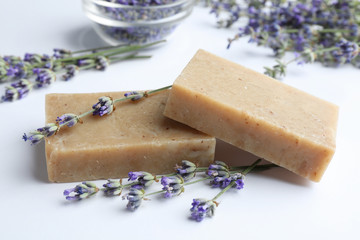 Hand made soap bars with lavender flowers on white background