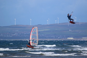 Kitesurfer and windsurfer riding off Barassie Beach, Troon