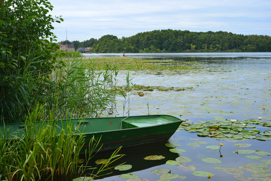 scenic view of the oberfuhlsee in Lychen, Germany, Brandenburg region with water plants and a boat