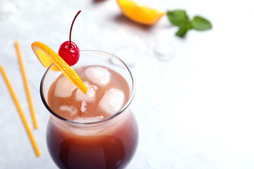 Glass of tasty refreshing cocktail on table, closeup. Space for text