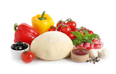 Fresh dough and ingredients for pizza on white background