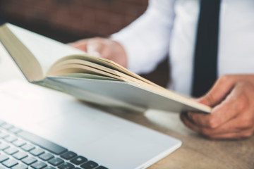 man hand book and  computer keyboard