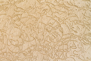 Beige stone wall with abstract pattern