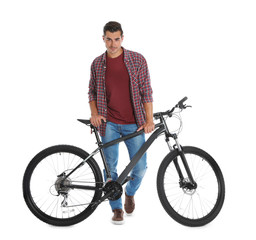 Obraz premium Handsome young man with modern bicycle on white background