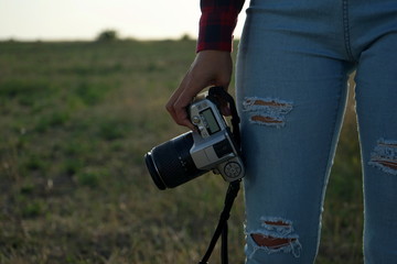 girl with a camera in nature