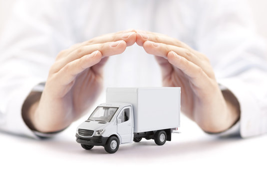 Cargo delivery truck protected by hands 