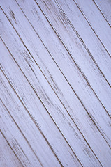 Obraz premium light background in the form of hammered together wooden boards. painted with white paint with scuffs