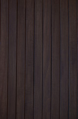 dark background made of connected boards of dark brown color