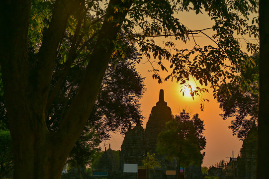 Thousand temple view with golden sky background and trees nature frame