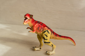 carnivorous dinosaur tyrannosaurus rex.plastic dinosaur figures of extinct ancient creatures and  favorite toys of kids