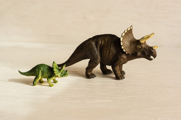 horned triceratops with cub. plastic dinosaur figures of extinct ancient creatures and  favorite toys of kids © sotnikova_vera