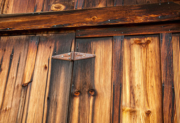 Old wooden door with hing