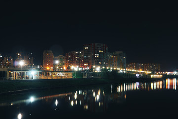 Fototapeta na wymiar landscape of the night city by the river