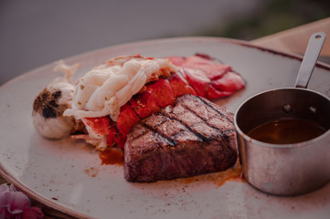 Steak and Lobster dish with sauce