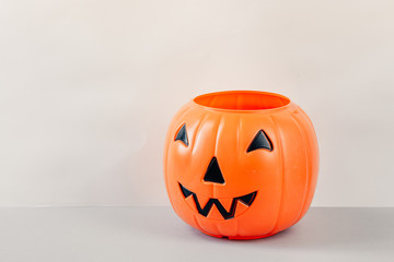 Happy Halloween Day, Spooky day. Pumpkin trick or treat basket, orange pumpkins, scary metal house