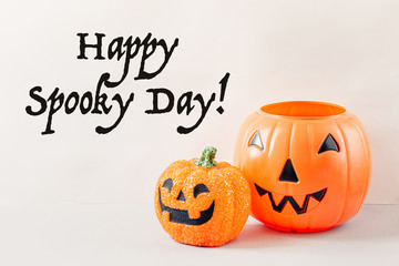 Happy Halloween Day, Spooky day. Pumpkin trick or treat basket, orange pumpkins, scary metal house