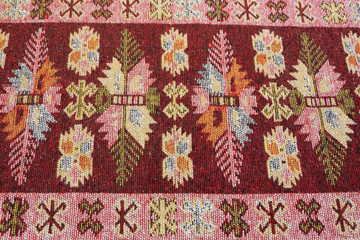 Crop view of traditional handmade carpet. Ethnic motives