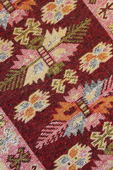 Crop view of traditional handmade carpet. Ethnic motives