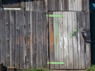 rusty lock hanging on old gate