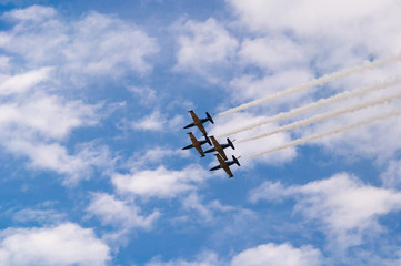 Team flight of training jets in the sky.
