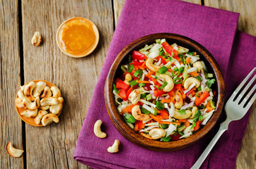 Cabbage red bell pepper carrot parsley cashews salad