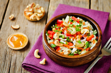 Cabbage red bell pepper carrot parsley cashews salad