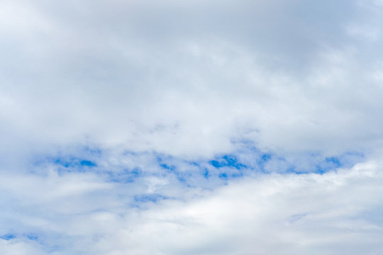 Cloudy blue real sky with light grey clouds. The blur sky background, high resolution 3.