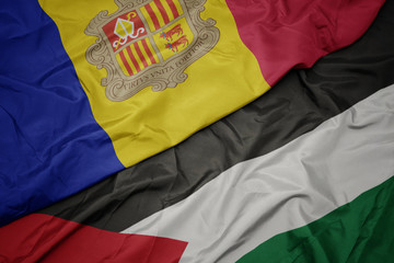 waving colorful flag of palestine and national flag of andorra.