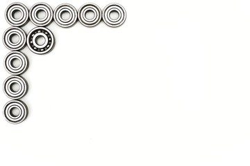 Set of various gears and ball bearings old and new, black and white, texture background