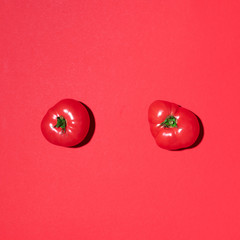Red tomatoes pattern on red background. Flat lay, top view. Summer minimal concept. Vegan and vegetarian diet