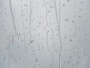 The raindrops and drips on a glass