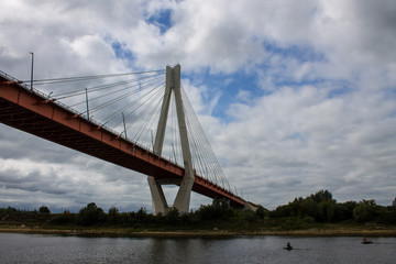 Fototapeta na wymiar Cable-stayed bridge in Murom Russia across the Oka river on a summer cloudy day