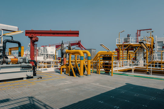 Riser pipes on deck of port