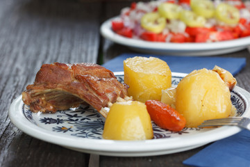 Lamb with potatoes and vegetables on plate