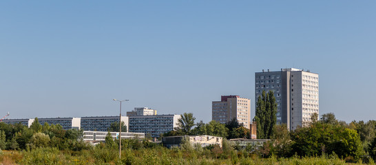 Typical modernized residential buildings in Leipzig city center with blue sky, architecture from...