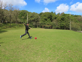 Fototapeta premium man kicking a ball