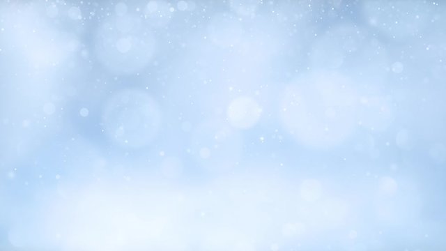 Artistic blurry snowflakes on blue sky copy space background.