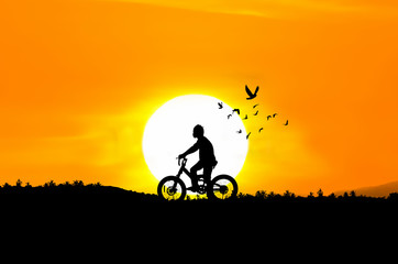 Fototapeta premium Silhouette illustration of a boy riding a bicycle