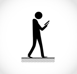 Danger on road sign concept - man with mobile phone walking through crossroad