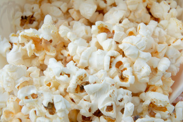 Solt or sweety popcorn close-up. Background of popcorn. Snacks and food for a movie